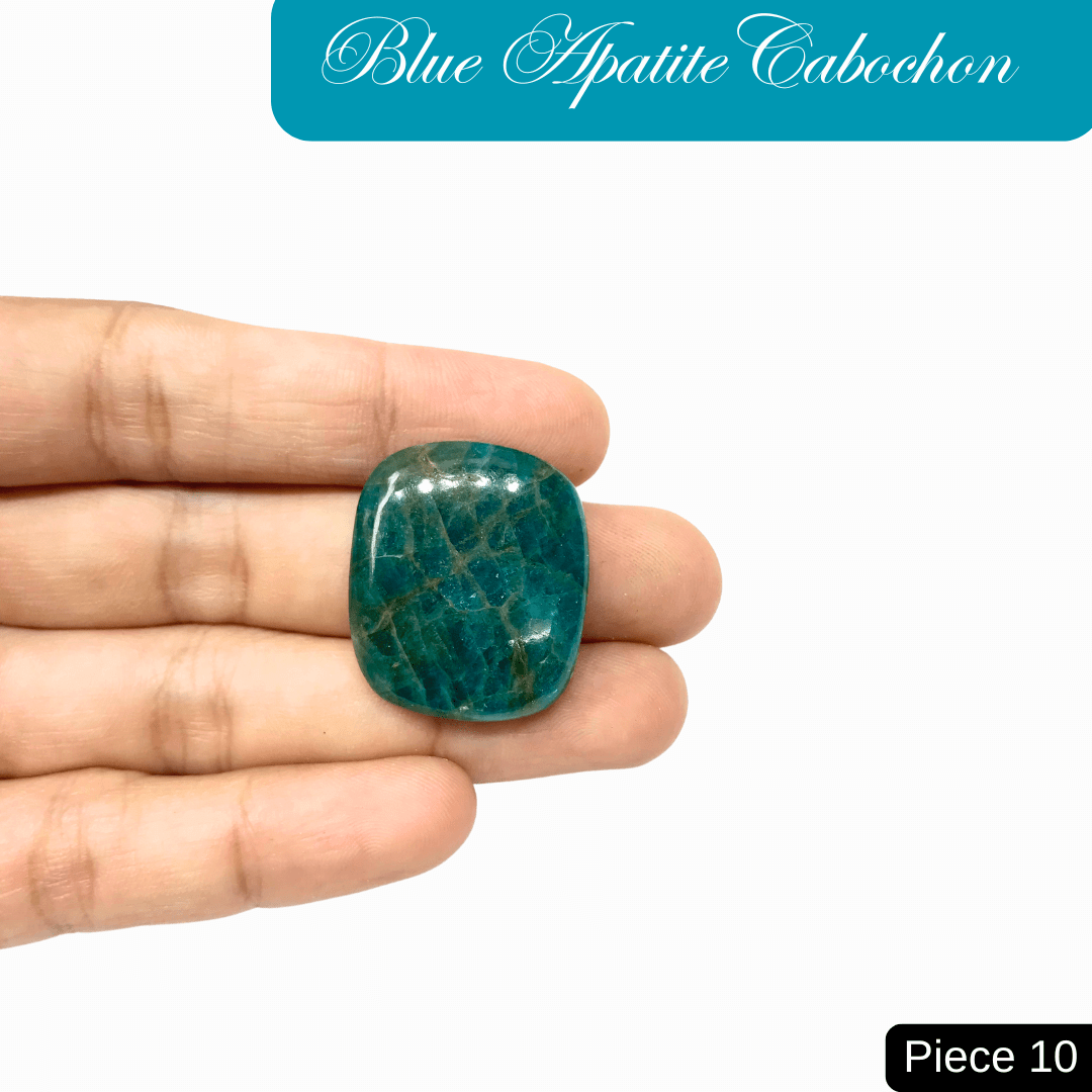 Person holding a blue apatite cabochon, a translucent gemstone with vibrant ocean blue shades, known for enhancing clarity and personal growth.
