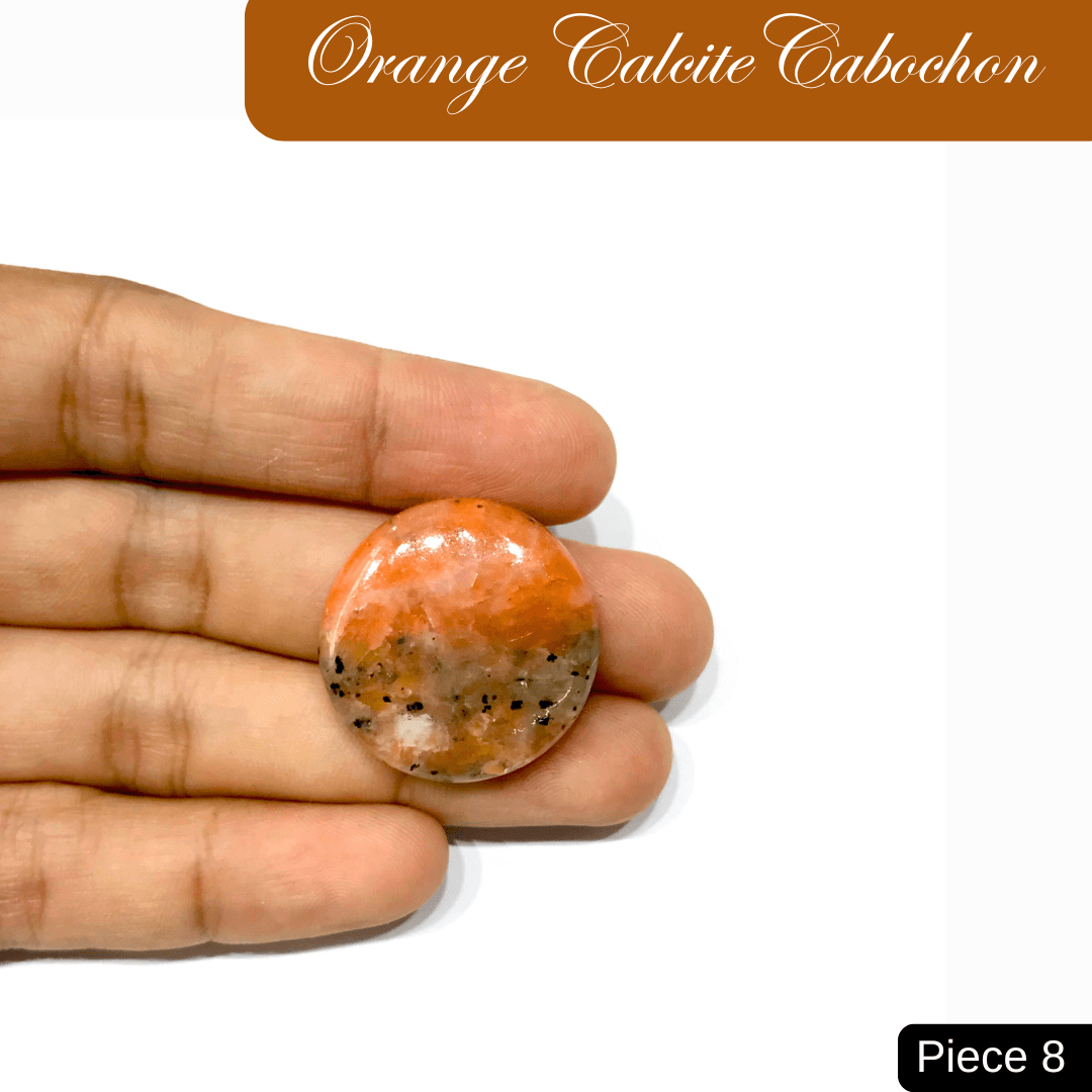 Orange Calcite Cabochon Piece 8 held in hand, showcasing its vibrant, sunny hue and distinctive texture.