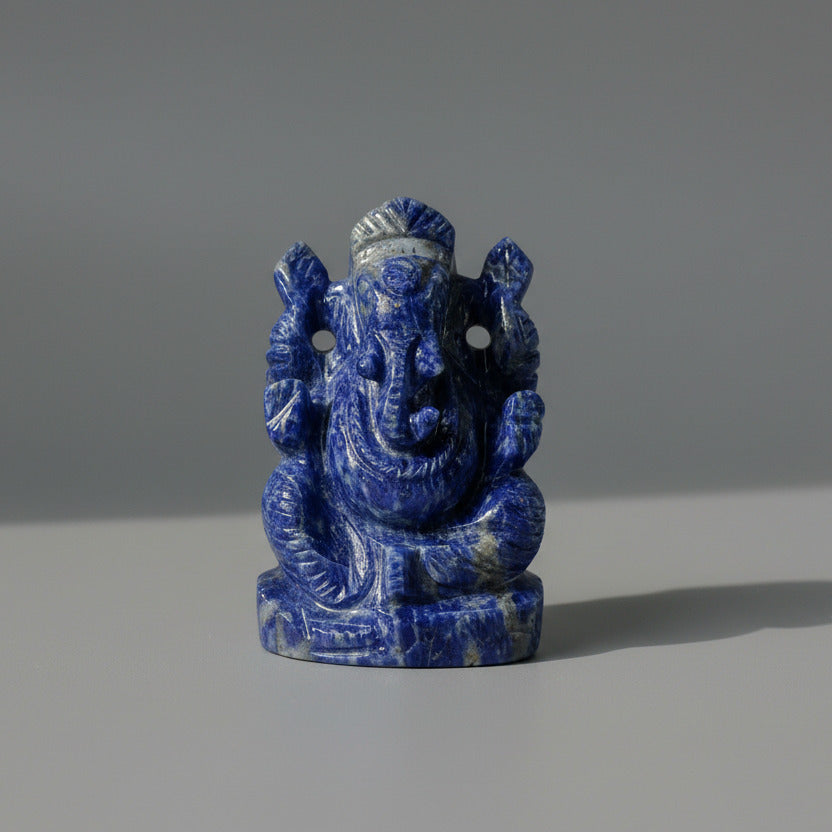 Sodalite Blue stone Ganesh statue on a white background