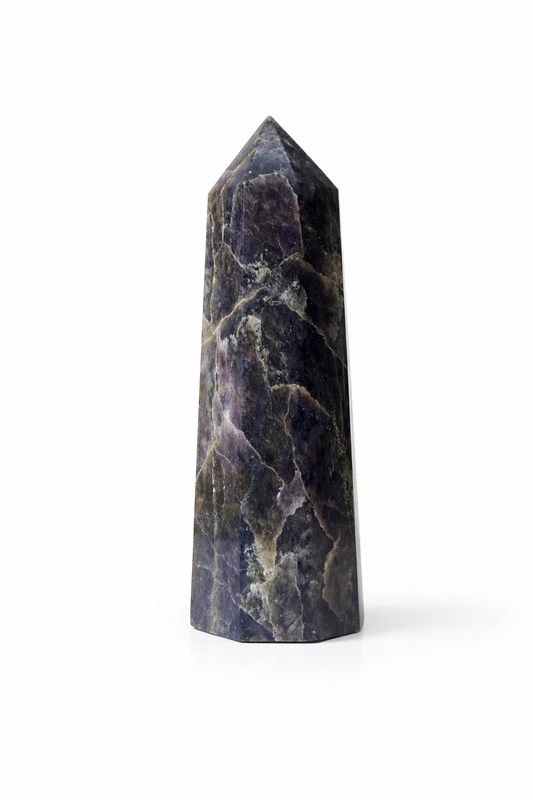 Decorative stone obelisk on a white background