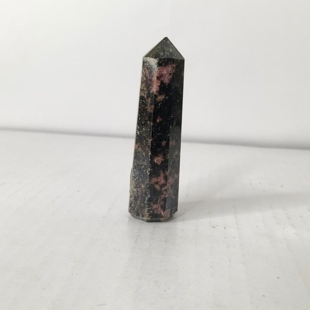 Black and pink crystal tower on a white background