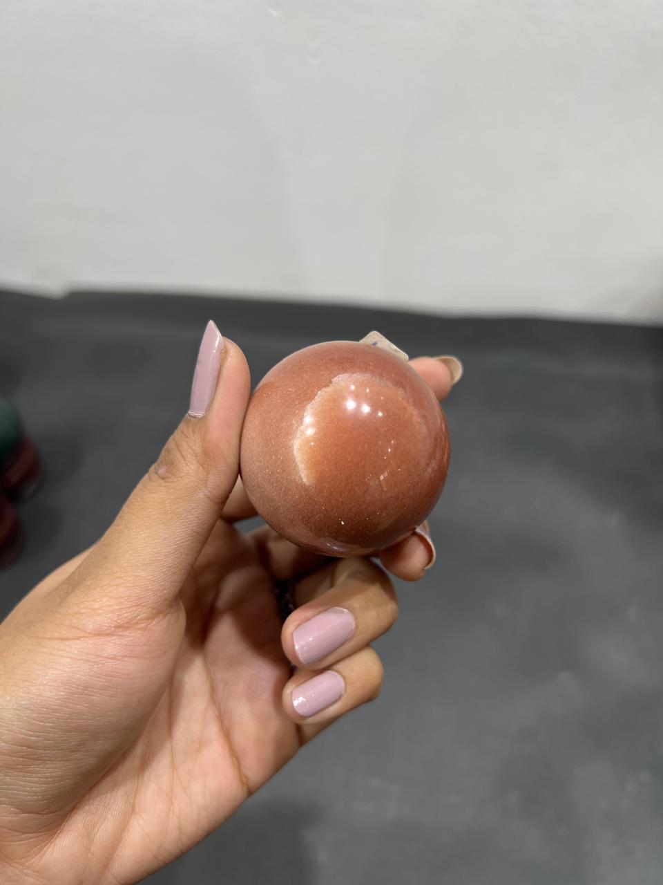 Red Aventurine Sphere 125g - AEORA ROCKS INDIA -Healing Crystals superstore