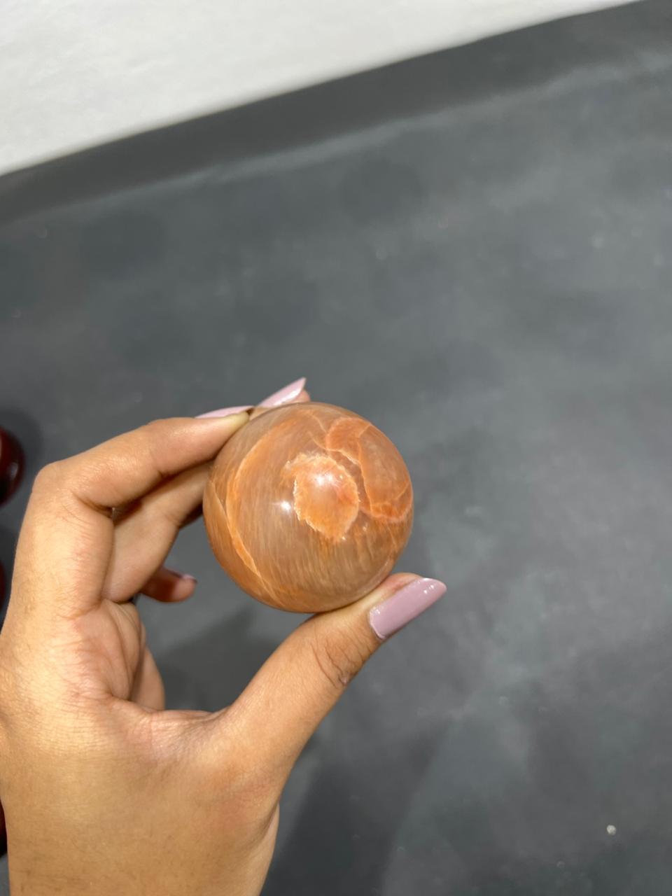 Orange Moonstone Sphere 166g - AEORA ROCKS INDIA -Healing Crystals superstore