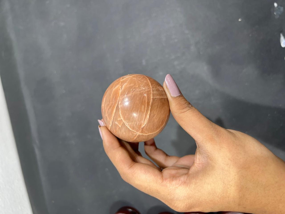 Orange Moonstone Sphere 260g - AEORA ROCKS INDIA -Healing Crystals superstore