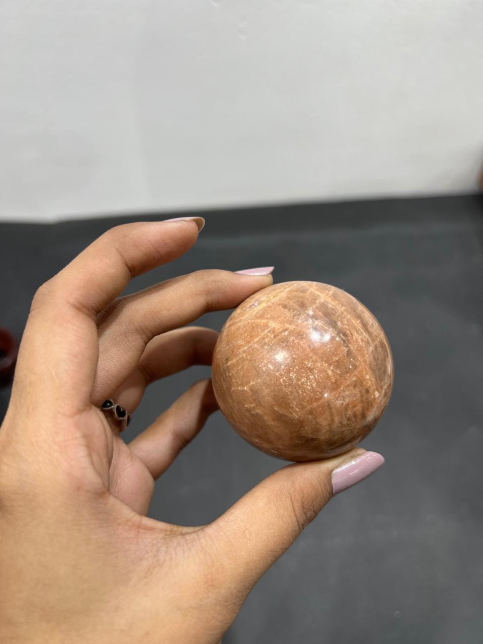 Orange Moonstone Sphere 233g - AEORA ROCKS INDIA -Healing Crystals superstore