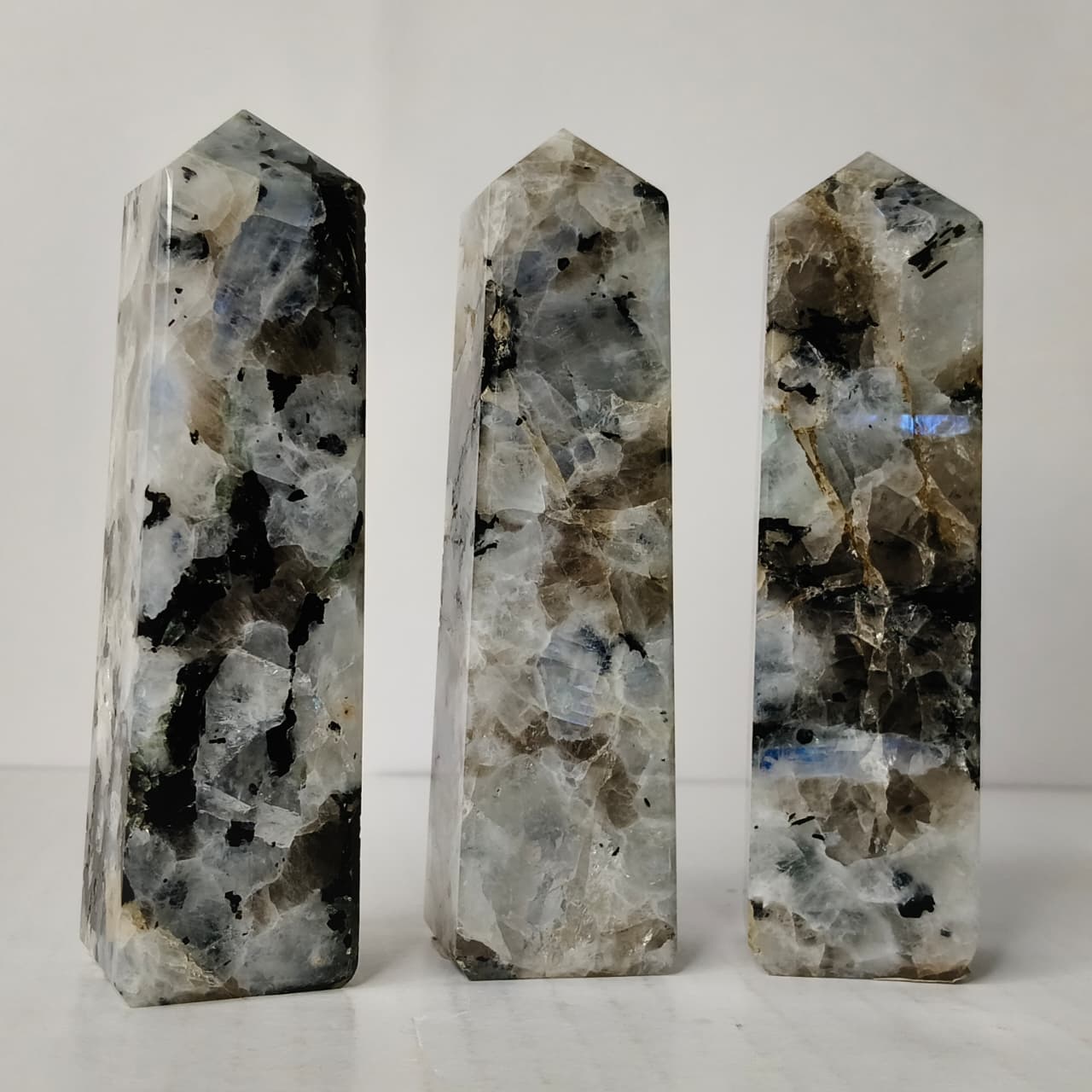 Three crystal towers with a white background