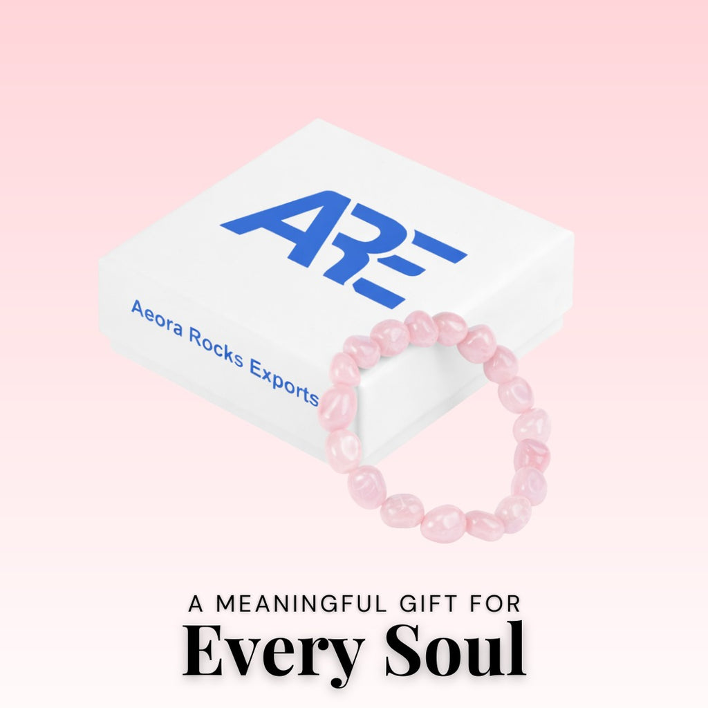 Pink beaded bracelet on a white card with 'Aera Rocks Exports' branding against a pink background.