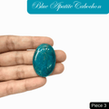 Blue Apatite cabochon held in hand, showcasing vibrant translucent ocean blue color, known for clarity-enhancing properties.