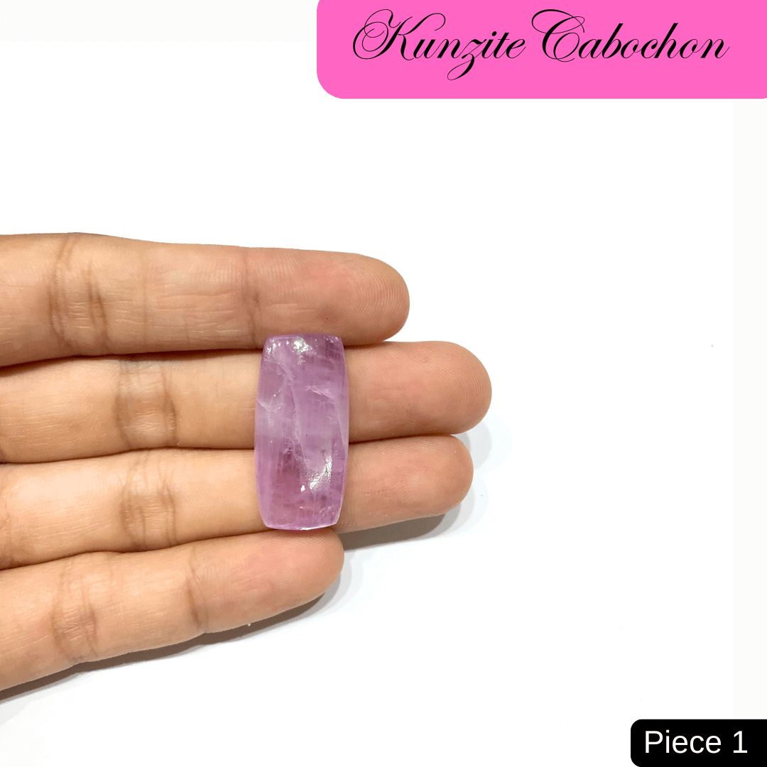 Hand holding a pink Kunzite Cabochon gemstone, known for its high-vibrational energy and association with love and healing.