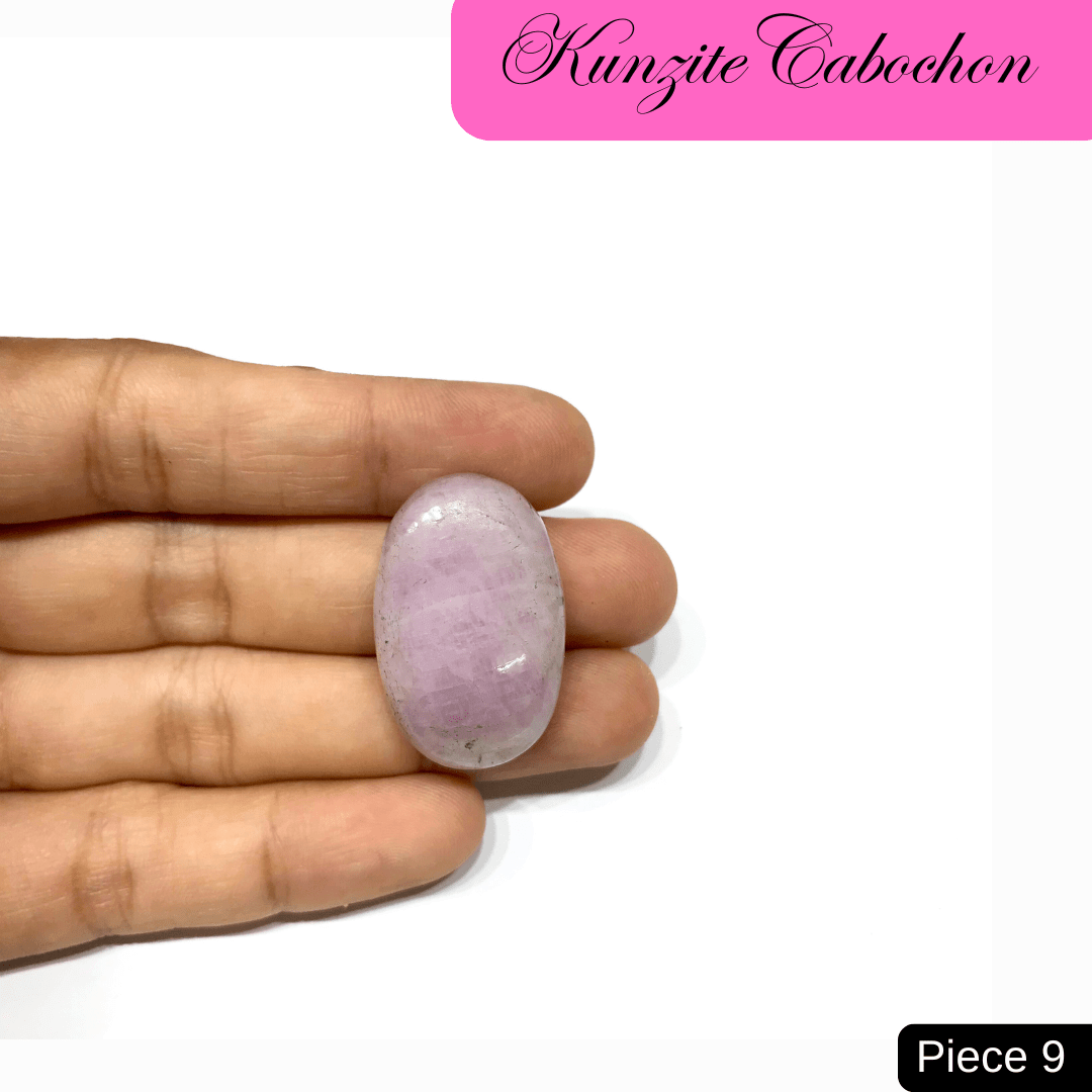 Hand holding a soft pink Kunzite cabochon gemstone, known for its spiritual awakening and healing properties, labeled as piece 9.