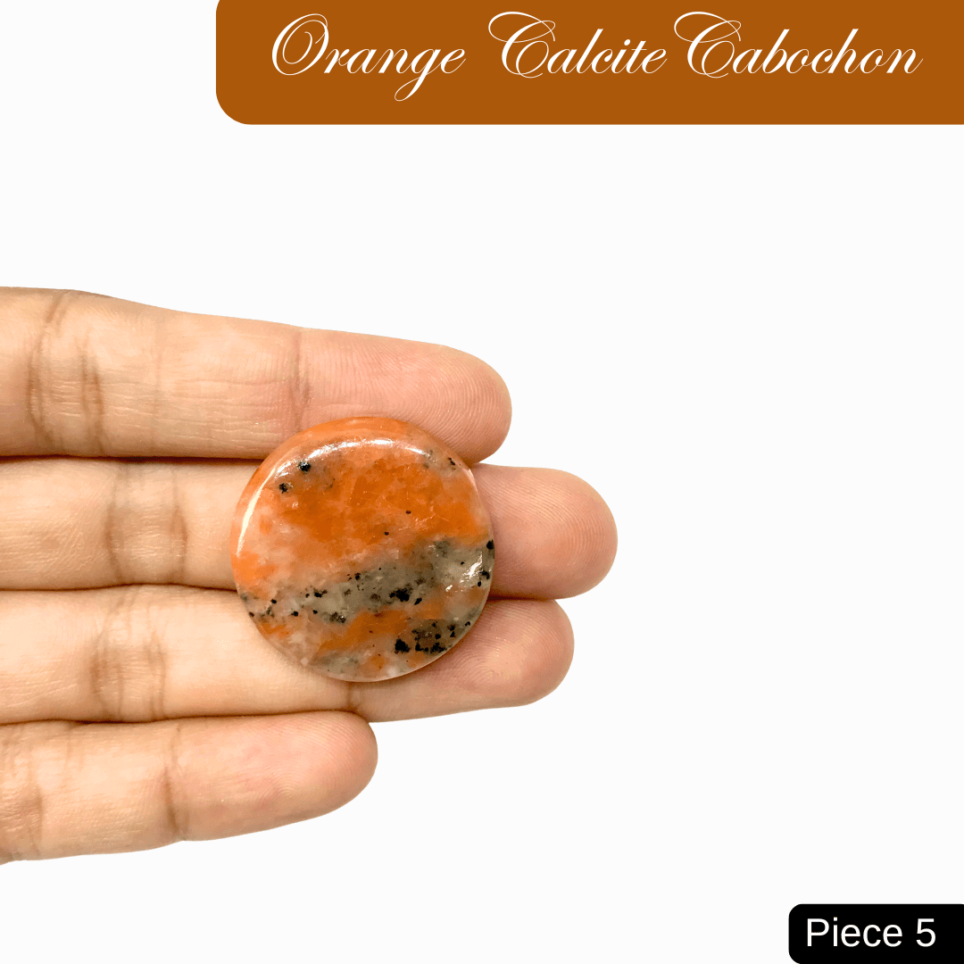 Hand holding vibrant Orange Calcite cabochon gemstone, known for its creativity and inspiration properties, labeled 'Piece 5'. 