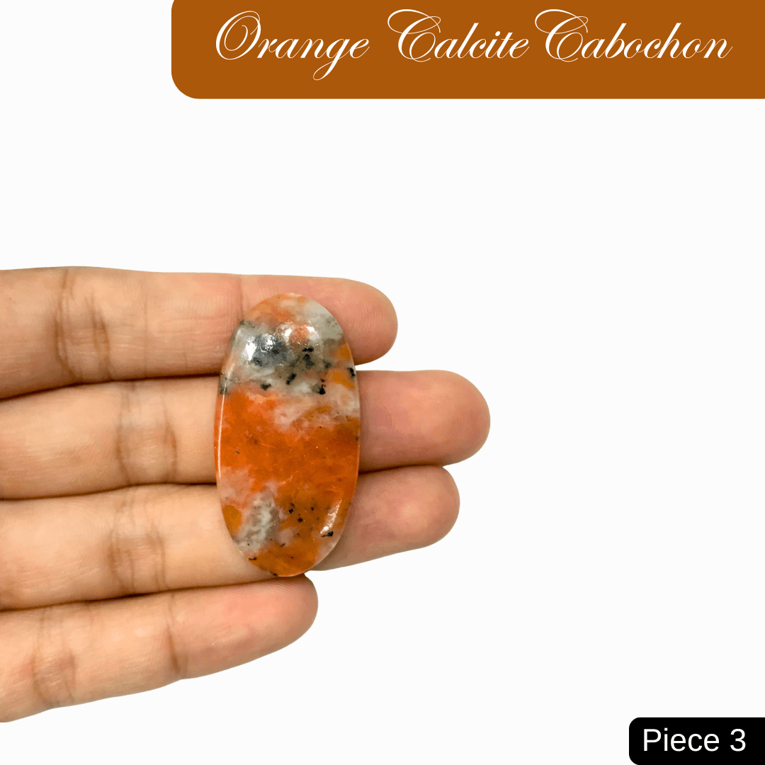 "Hand holding an Orange Calcite Cabochon, a vibrant gemstone for creativity and inspiration, Piece 3."