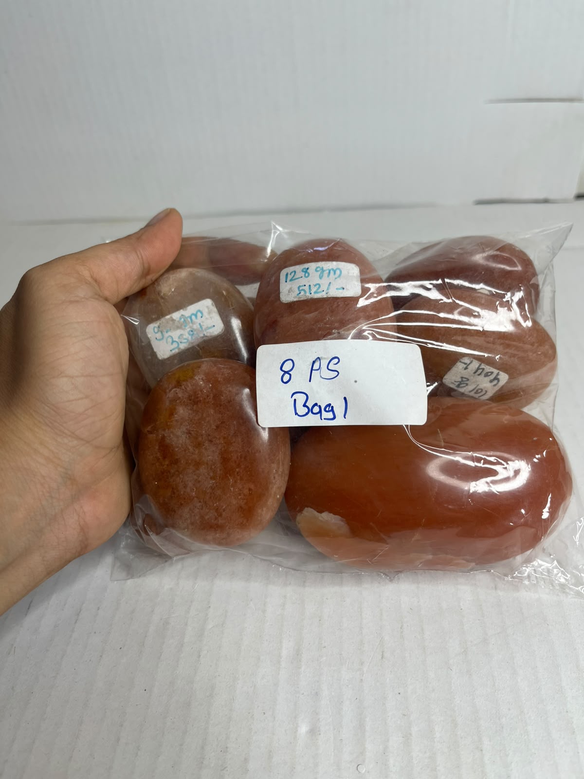 SUNSET AVENTURINE PALMSTONS BAG 1 - 1KG, 8 PCS