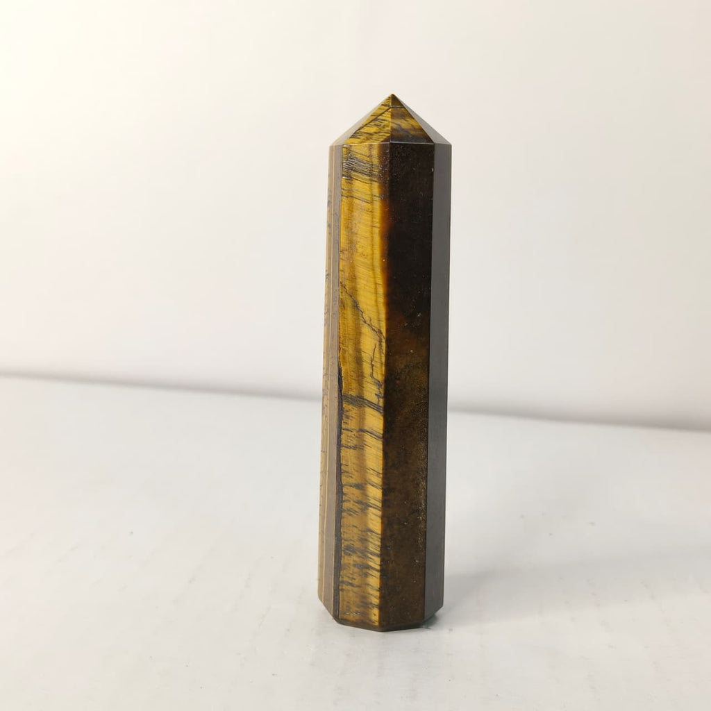 Tiger eye crystal tower on a white background
